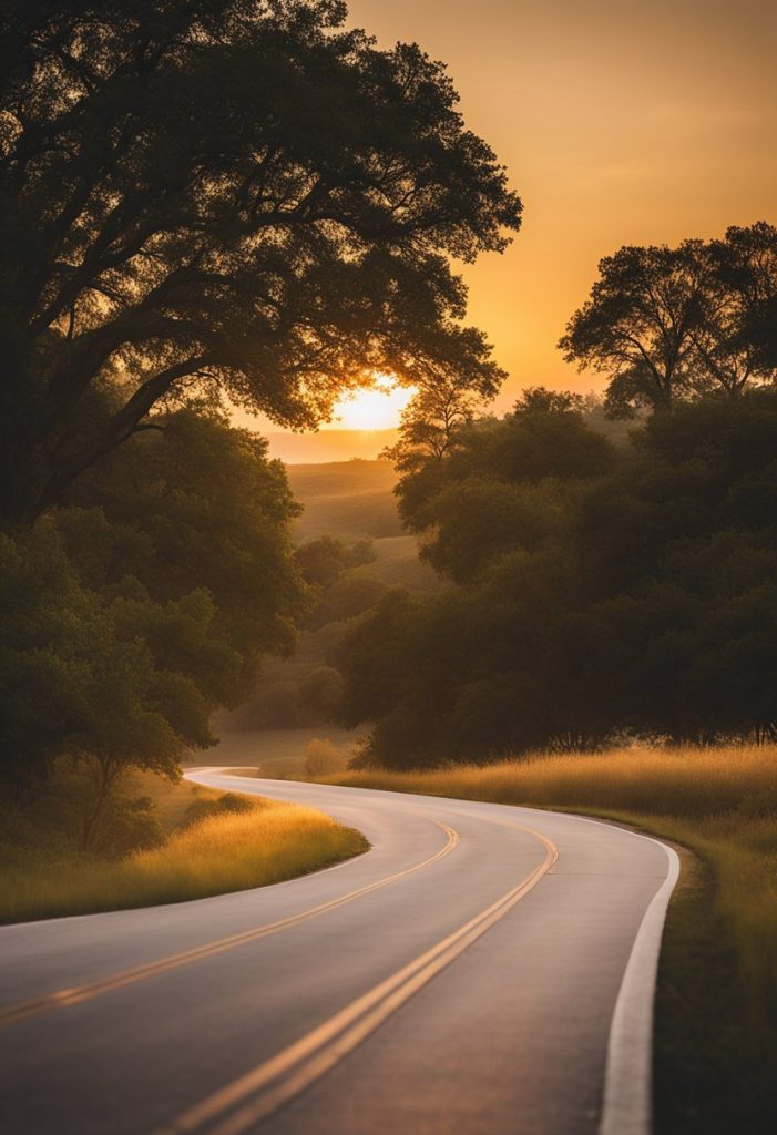 Rolling hills, winding roads, and lush greenery make up Waco's best scenic drives. The sun sets behind the horizon, casting a warm glow over the landscape