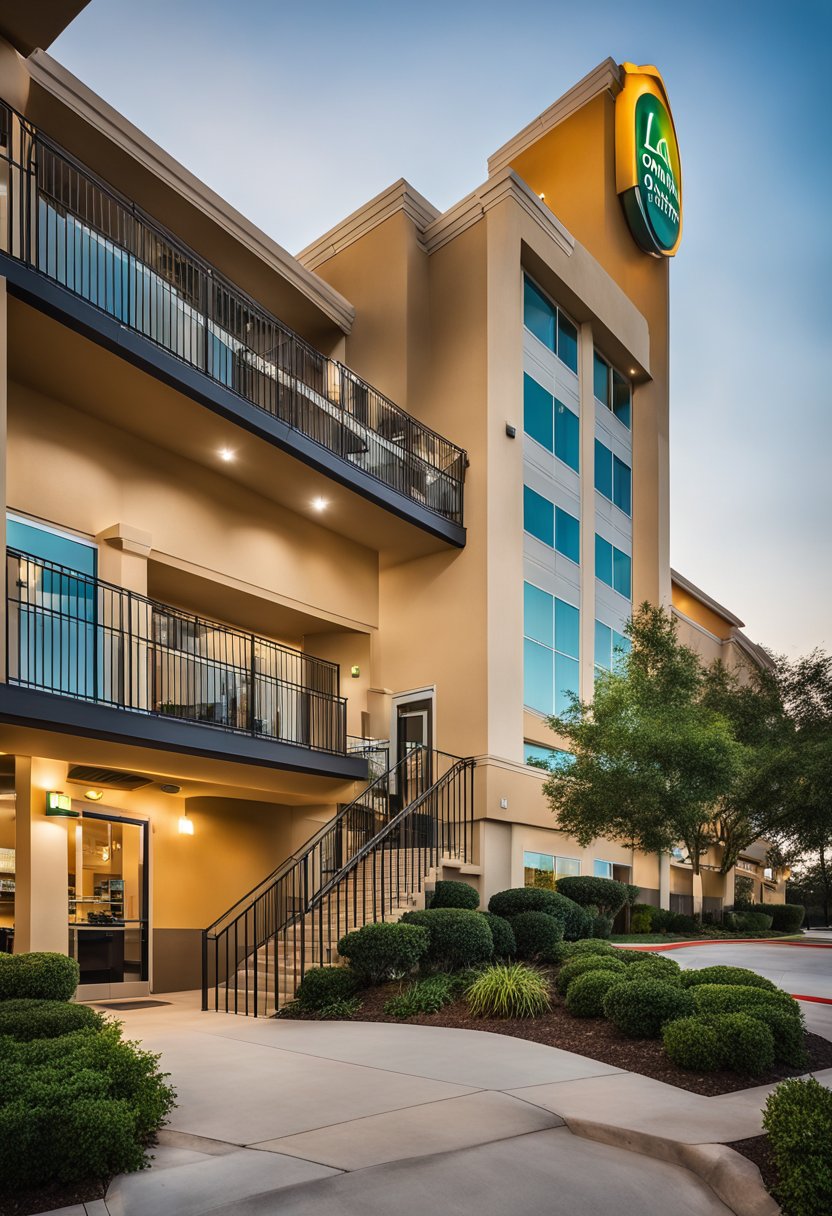 The La Quinta Inn & Suites by Wyndham Waco Downtown - Baylor is a budget-friendly hotel in Waco. The building features a modern design with clean lines and a welcoming entrance. The surrounding area includes greenery and a bustling cityscape