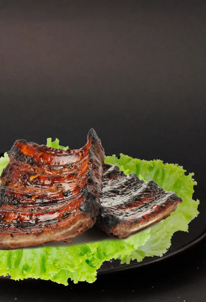 Grilled ribs on a bed of lettuce served at Red Wagon BBQ Restaurant in Waco.