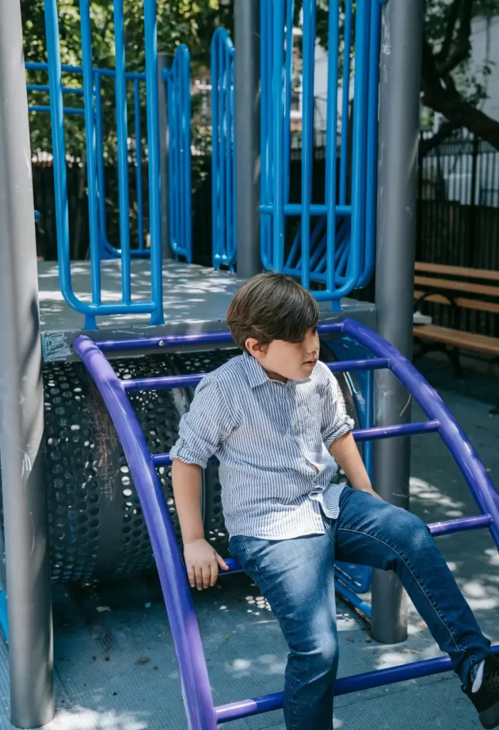 Boy playing in Kendrick Park in Waco, Texas.
