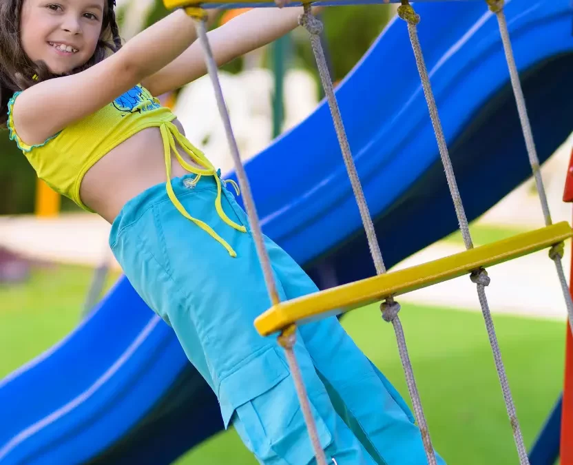 Girl playing in Kendrick Park in Waco, Texas.