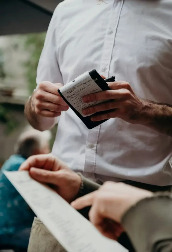 Best Southern Restaurants in Waco Tips for Dining in Waco image of waiter getting order