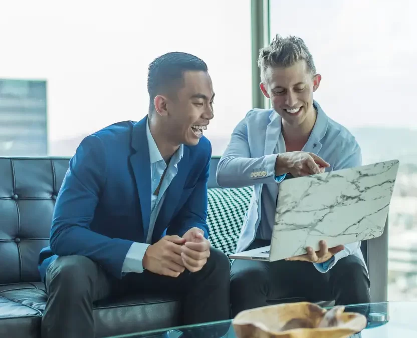 Two businessmen discussing in a hotel lobby