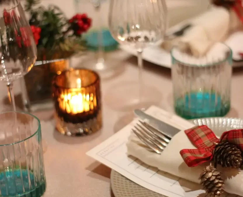 Tableware in a restaurant with Christmas decor, perfect for Dining Out in Waco on Christmas Day.