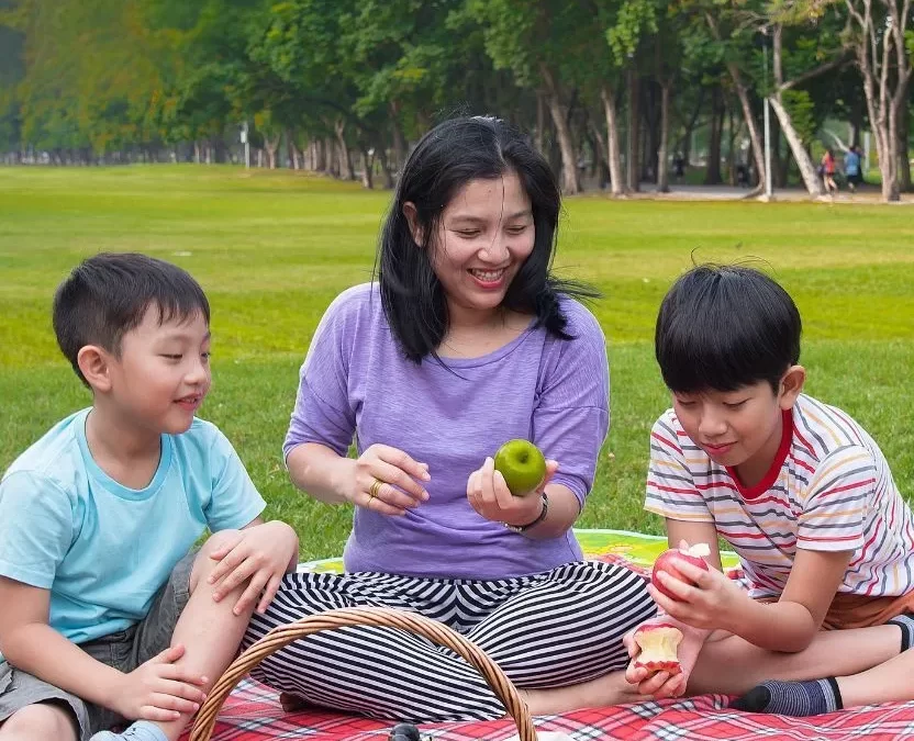 Family enjoying a picnic in one of the Top 10 Picnic Parks in Waco, Texas.